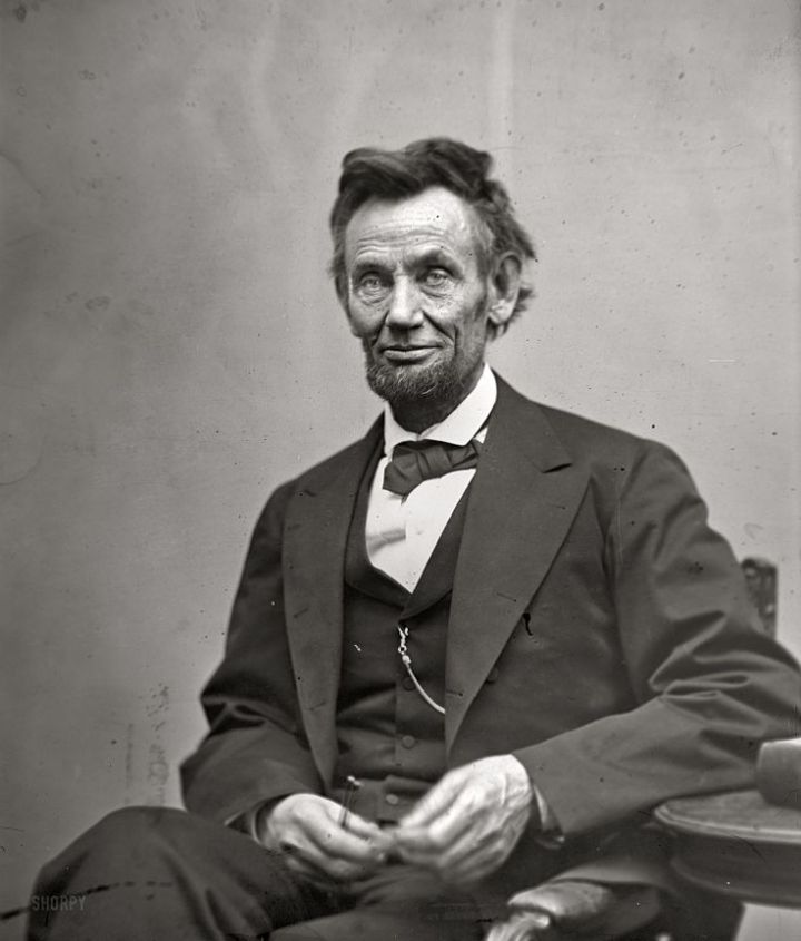 Figure 9:  Abraham Lincoln, seated, holding spectacles and a pencil, Feb 5 1865, Alexander Gardner